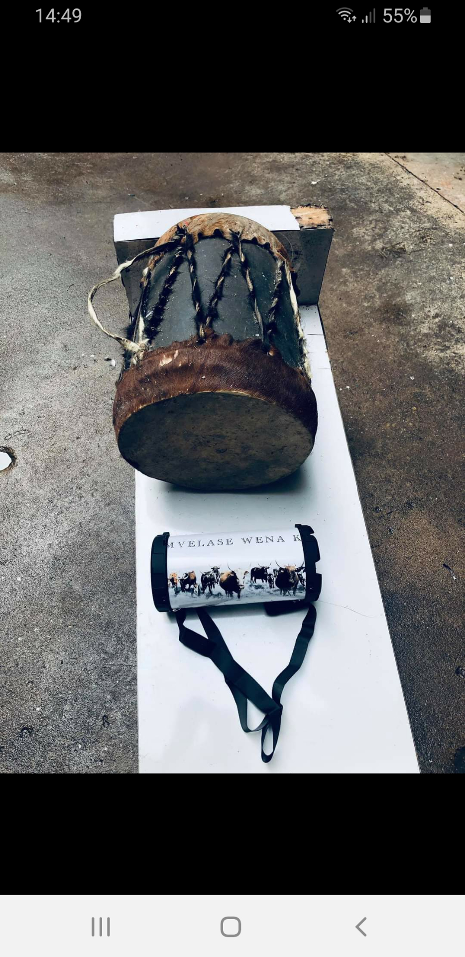 Early Turnup prototype next to a traditional isigubhu drum